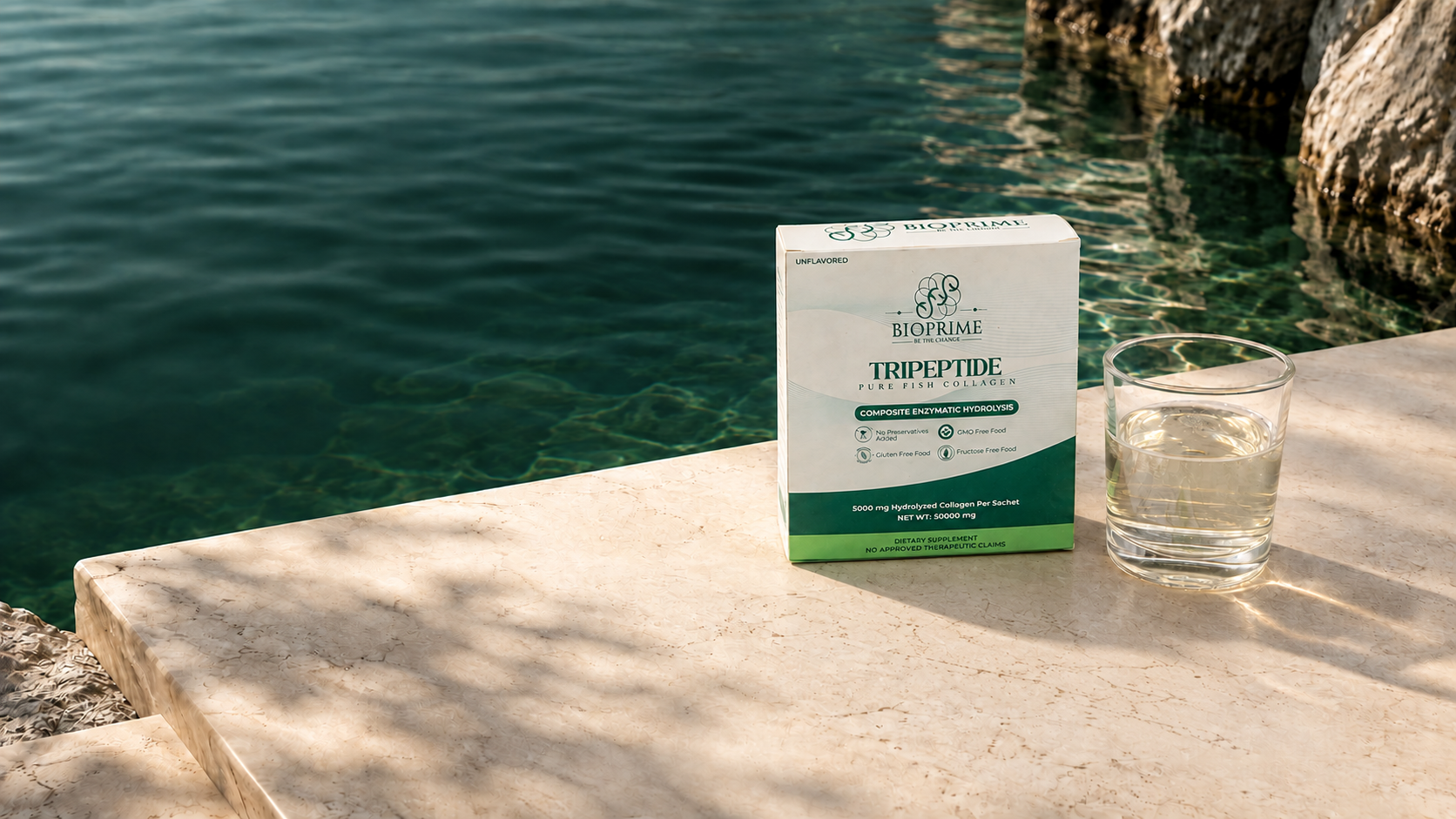 BioPrime box and glass beside emerald water